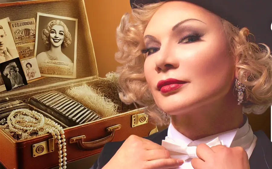 Bild von einer Dame mit einem offenen Koffer mit Perlenkette, Zeichnungen und anderen Requisiten