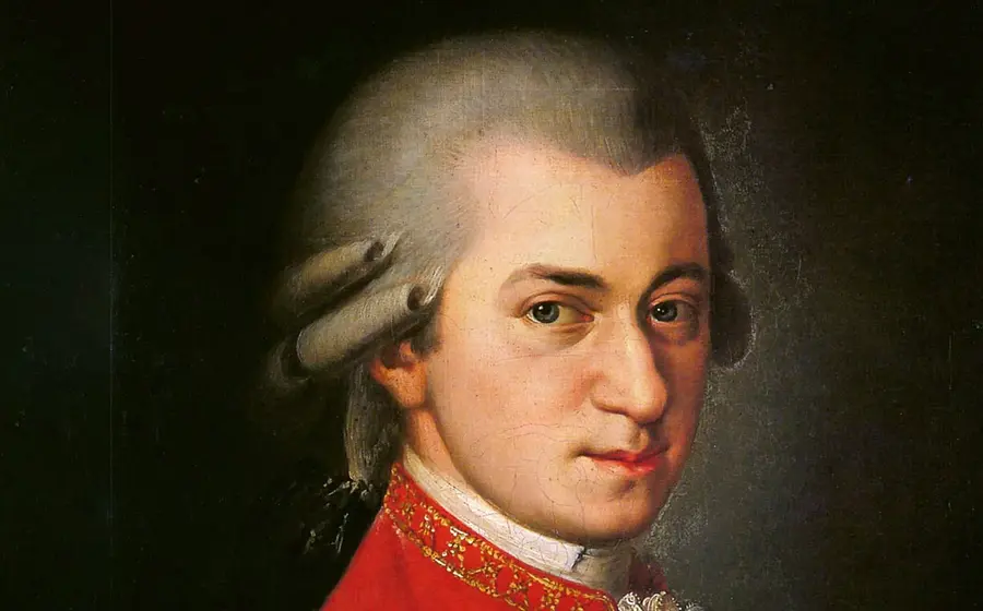 Porträt eines klassischen Komponisten aus dem 18. Jahrhundert mit weißer Perücke und rotem Mantel – Symbolbild für das Konzert „Mozart-Requiem – Chor der Arcis Vocalisten und Orchester L’Arpa festante“