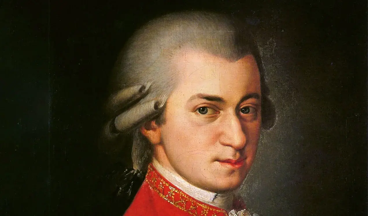 Porträt eines klassischen Komponisten aus dem 18. Jahrhundert mit weißer Perücke und rotem Mantel – Symbolbild für das Konzert „Mozart-Requiem – Chor der Arcis Vocalisten und Orchester L’Arpa festante“