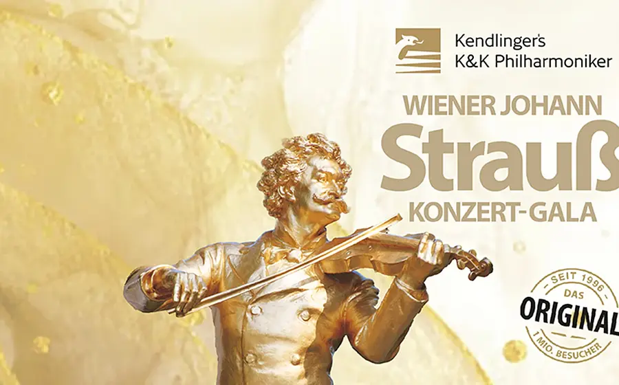 Keyvisual zur „Wiener Johann Strauss Konzert‑Gala“ der Kendlinger’s K&K Philharmoniker mit goldfarbener Statue eines Violinspielers vor hellem Hintergrund und Veranstaltungstitel im Bild.